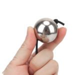 ballenklem, ball crusher, verstelbaar ontwerp, gewichtbal, luxe uitvoering, SM accessoires, BDSM speeltjes, gecontroleerde druk, intensieve stimulatie, hoogwaardige materialen.